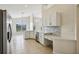 Kitchen with white cabinets, quartz countertops, and stainless steel appliances at 235 Royal Palm Dr, Davenport, FL 33837