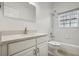 Clean bathroom with white vanity, bathtub, and tile flooring at 235 Royal Palm Dr, Davenport, FL 33837