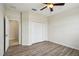 Simple bedroom with wood-look flooring and a large closet at 235 Royal Palm Dr, Davenport, FL 33837