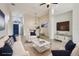 Bright and airy living room with comfortable sofas and a large TV at 235 Royal Palm Dr, Davenport, FL 33837