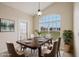 Virtually staged dining room with a table and chairs at 235 Royal Palm Dr, Davenport, FL 33837