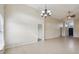 Spacious living room with tile floors and a chandelier at 235 Royal Palm Dr, Davenport, FL 33837
