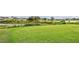 Golf course tee with water feature and homes visible at 235 Royal Palm Dr, Davenport, FL 33837