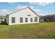 House exterior showcasing backyard and landscaping at 235 Royal Palm Dr, Davenport, FL 33837