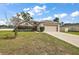 One-story house with a garage and a well-maintained lawn at 2713 Sw 158Th St, Ocala, FL 34473