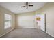 Bright bedroom with a ceiling fan and access to other rooms at 2713 Sw 158Th St, Ocala, FL 34473