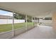 Spacious screened porch with tiled floor and backyard access at 2713 Sw 158Th St, Ocala, FL 34473