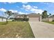 House exterior featuring a two car garage and landscaping at 2713 Sw 158Th St, Ocala, FL 34473