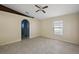 Spacious bedroom with ceiling fan, large window, and tile flooring at 2713 Sw 158Th St, Ocala, FL 34473