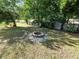 Spacious backyard with firepit and seating area at 2816 Paine Ln, Orlando, FL 32826