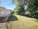 Large backyard with grassy area and fence at 2816 Paine Ln, Orlando, FL 32826