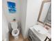 Small bathroom with toilet, sink, and updated vanity at 2816 Paine Ln, Orlando, FL 32826