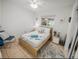 Cozy bedroom with light wood platform bed and window views at 2816 Paine Ln, Orlando, FL 32826