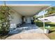 Covered carport with concrete slab and storage area at 2816 Paine Ln, Orlando, FL 32826