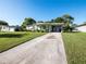 Ranch home with long driveway and mature landscaping at 2816 Paine Ln, Orlando, FL 32826