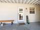 Inviting front entry with wooden bench and keyless entry at 2816 Paine Ln, Orlando, FL 32826