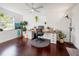 Bright home office features a large desk, wood floors, and plenty of natural light at 2816 Paine Ln, Orlando, FL 32826