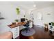 Home office with wood desk, window light, and wood floors at 2816 Paine Ln, Orlando, FL 32826