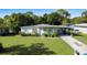 House front view, showing landscaping and driveway at 2816 Paine Ln, Orlando, FL 32826