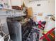 Laundry room with washer, dryer, and storage shelves at 2816 Paine Ln, Orlando, FL 32826