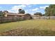 Large backyard with wooden fence and grassy area at 3375 Sw 147Th Lane Rd, Ocala, FL 34473