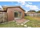 Backyard view of home with sliding glass doors at 3375 Sw 147Th Lane Rd, Ocala, FL 34473