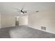 Living area with gray tile floors and a ceiling fan at 3375 Sw 147Th Lane Rd, Ocala, FL 34473