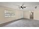Living room featuring gray tile floors and a window with blinds at 3375 Sw 147Th Lane Rd, Ocala, FL 34473