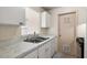 White kitchen cabinets and double sink at 3375 Sw 147Th Lane Rd, Ocala, FL 34473