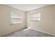 Bright bedroom with two windows and neutral walls at 3375 Sw 147Th Lane Rd, Ocala, FL 34473