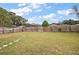 Large backyard with wooden fence and grassy area at 3375 Sw 147Th Lane Rd, Ocala, FL 34473