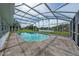 Screened-in pool area with canal views at 357 Lariat Ln, Kissimmee, FL 34743