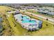 Community pool and surrounding area with houses in background at 4953 Kaia Ave, Winter Haven, FL 33884