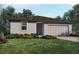 One-story home with gray siding, brown roof, and attached garage at 4953 Kaia Ave, Winter Haven, FL 33884