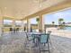 Community pool area with covered seating and tables at 4953 Kaia Ave, Winter Haven, FL 33884