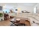 Open living room with sectional sofa, creating a comfortable and inviting space at 5 Oak Trl, Ocala, FL 34472