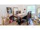 Bright dining room with a dark wood table and six leather chairs at 5 Oak Trl, Ocala, FL 34472