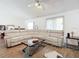 Spacious living room featuring a large sectional sofa and wood coffee table at 5 Oak Trl, Ocala, FL 34472