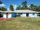 Ranch style home with a well-maintained lawn at 5 Oak Trl, Ocala, FL 34472
