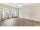 Bright bedroom with wood-look floors and bay window at 6526 Lake Pembroke Pl, Orlando, FL 32829