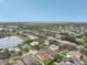 An aerial view of a house with a large backyard and surrounding neighborhood at 6526 Lake Pembroke Pl, Orlando, FL 32829