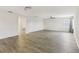 Spacious living room featuring hardwood floors and neutral color palette at 6526 Lake Pembroke Pl, Orlando, FL 32829