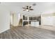 Spacious living room featuring wood-look flooring and a ceiling fan at 6526 Lake Pembroke Pl, Orlando, FL 32829