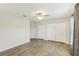 Well-lit bedroom with double closets and wood-look floors at 6526 Lake Pembroke Pl, Orlando, FL 32829