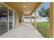 Covered patio with concrete flooring and access to backyard at 6526 Lake Pembroke Pl, Orlando, FL 32829
