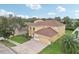 Two-story house with a large yard and a two car garage at 6526 Lake Pembroke Pl, Orlando, FL 32829