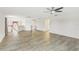 Bright and airy loft area with wood-look floors and ceiling fan at 6526 Lake Pembroke Pl, Orlando, FL 32829