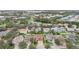 Aerial view of a house on a residential street with surrounding homes and landscape at 6526 Lake Pembroke Pl, Orlando, FL 32829