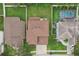 An overhead view showcasing a home's roofline, driveway, and surrounding landscape at 6526 Lake Pembroke Pl, Orlando, FL 32829
