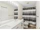 Bathroom boasts double vanity, shower/tub combo, and modern fixtures at 6526 Lake Pembroke Pl, Orlando, FL 32829